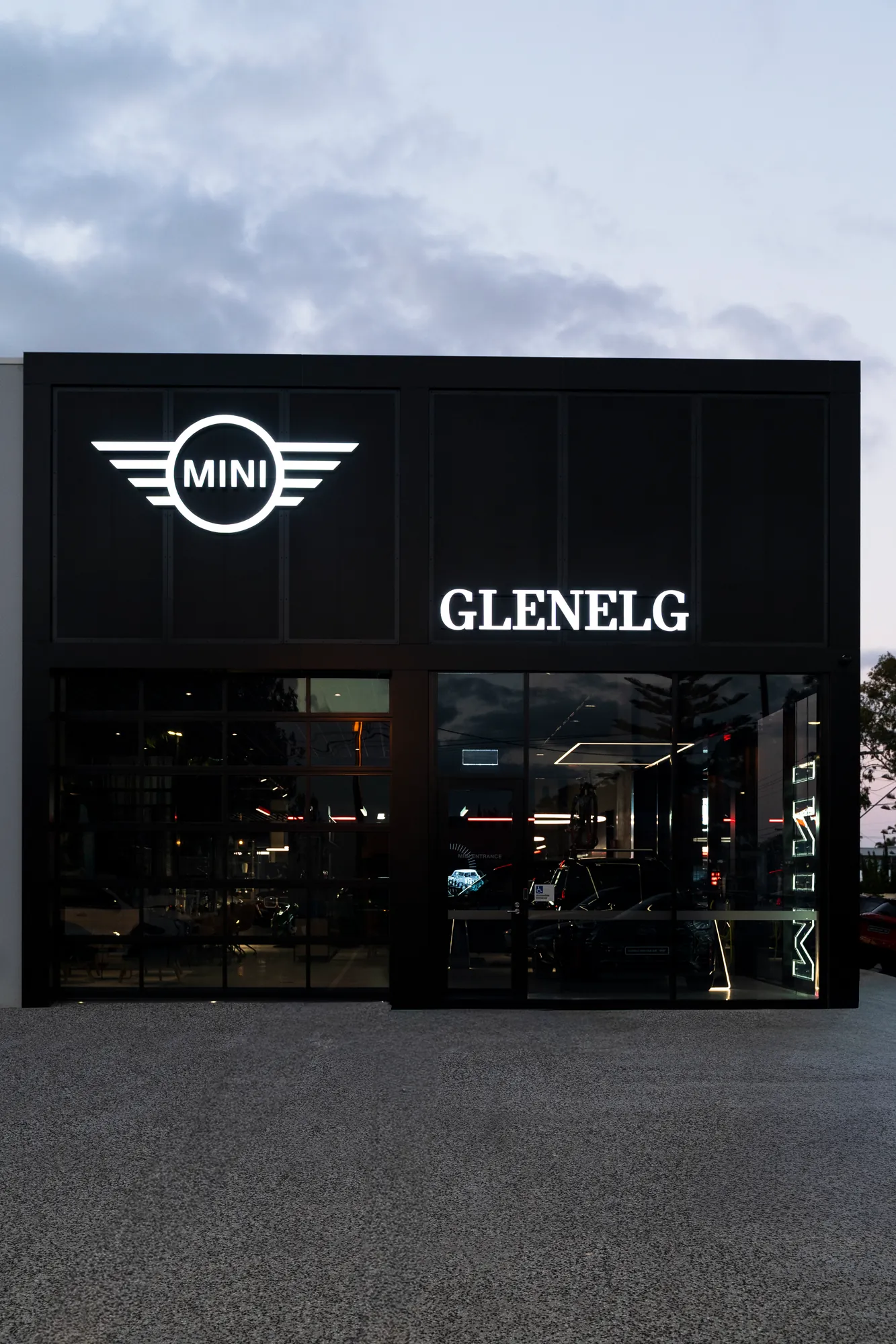 The MINI Glenelg showroom frontage at dusk