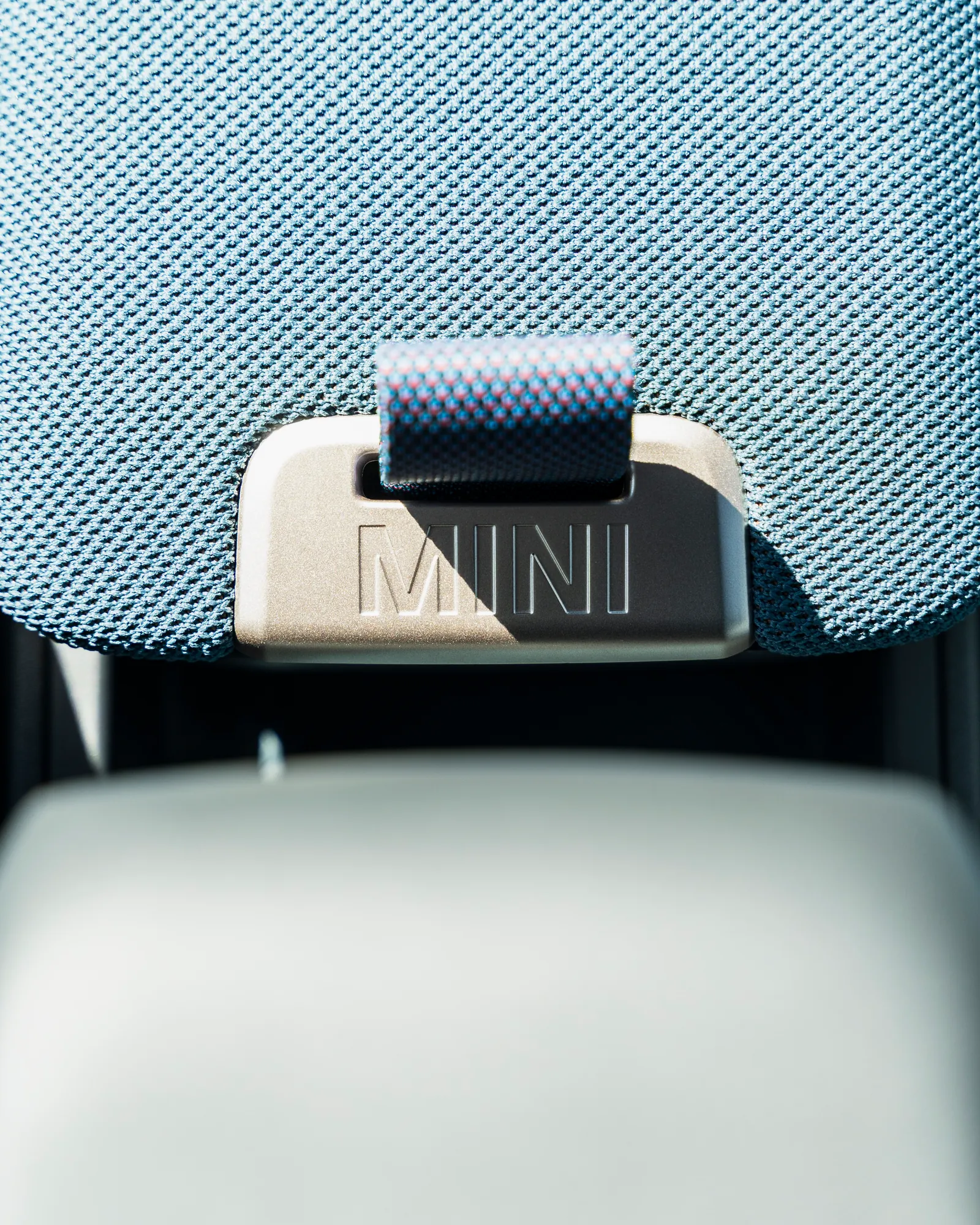 MINI-branded headrest detail in blue check upholstery