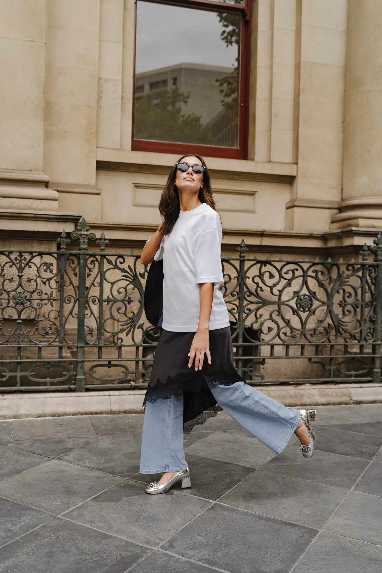 Penn Shoes autumn campaign: white tee, cropped jeans and metallic heels mid-stride