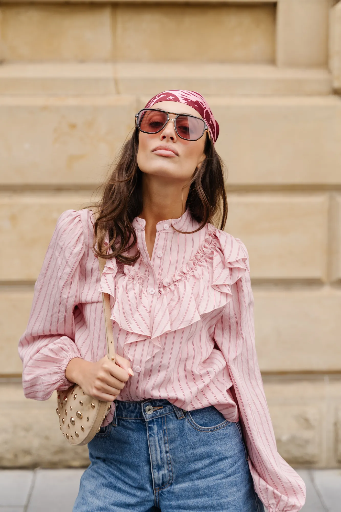 Penn Shoes autumn campaign: pink striped ruffle blouse, jeans and a woven bag